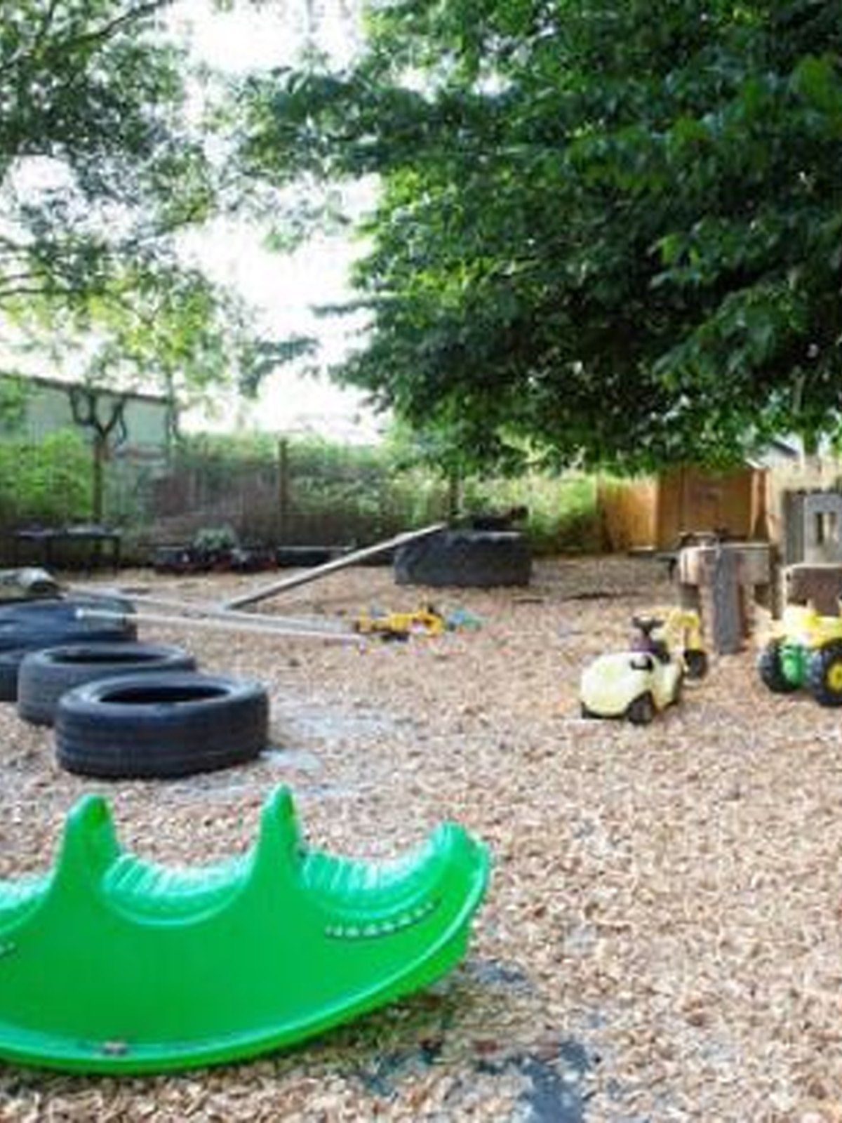 Children playing in the sandpit in the Bridge of Earn garden